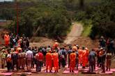 Rescue workers attend a mass for victims victims of a collapsed tailings dam owned by Brazilian mining company Vale SA, in Brumadinho