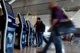 People checkin at Brazil’s airline Azul self-service check-in kiosks at Viracopos airport in Campinas